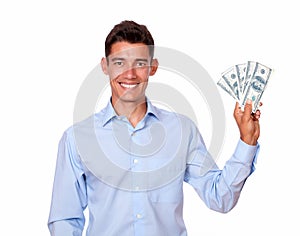 Ambitious man smiling and holding cash dollars