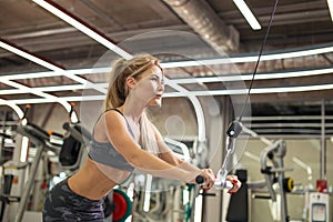 Ambitious woman working out on the rowing machine