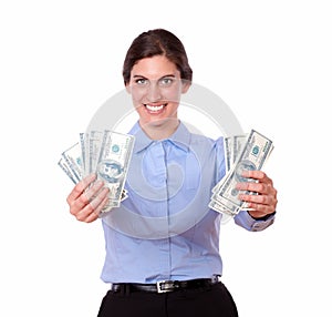 Ambitious young woman holding cash dollars