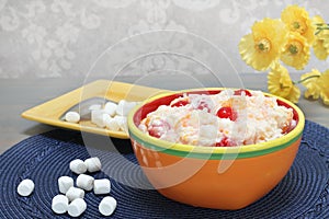 Ambrosia salad of oranges, cherries, coconut and marshmallows