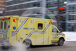 Ambulance car speeding city blurred motion