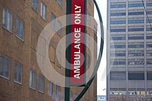 Ambulance entrance sign on a hospital building
