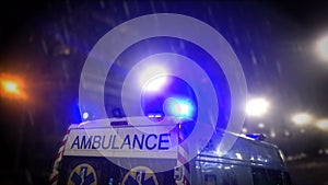 Ambulance in the night on rainy day