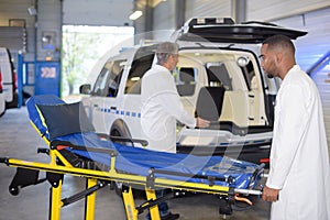 Ambulance team preparing vehicle