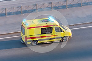 Ambulance van fast ride on highway, aerial top view