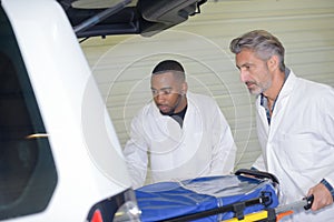 Ambulance worker preparing bed