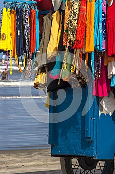 Ambulant vendor of clothes on the beach