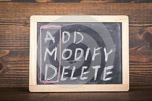 AMD. ADD, MODIFY and DELETE. Business concept. Chalk board with an inscription