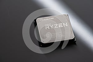 AMD Ryzen 5 CPU processor on grey background..