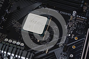 AMD Ryzen 5 3600 Processor close up in the X570 motherboard socket. New Zen 2, 7 nanometer desktop processor by AMD.