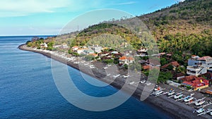 Amed bay coastline. Aerial drone view to calm sea in Amed, Bali, Indonesia
