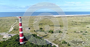 Ameland Lighthouse, North Sea and Dunes, Reveal Shot - Ameland, The Netherlands, 4K Drone Footage