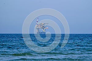 Ameland,Netherlands April 20,2021-NAM, Oil rig, offshore platform with sea water. Natural gas extraction in the Wadden