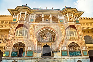 Amer Fort palace entrance gateway with intricate artwork at Jaipur Rajasthan, India