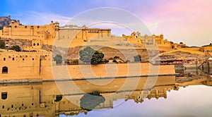 Amer Fort panoramic view with adjacent Maota lake at sunrise at Jaipur, Rajasthan, India