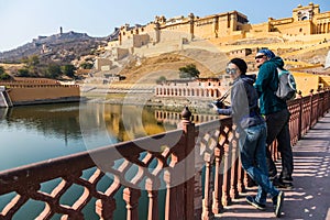 Amer Fort. Tourists by the lake Maota.