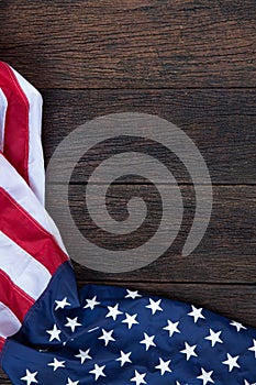 America flag waving pattern on wooden background in table top view, red blue white strip concept for USA 4th july independence day