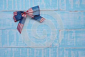 America ribbon on blue wood background