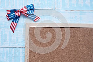 America ribbon on blue wood background.Wooden frame for text input