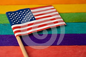 America USA flag on rainbow background symbol of LGBT gay pride month  social movement rainbow flag is a symbol of lesbian, gay,