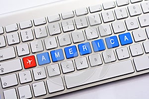 AMERICA writing on white keyboard with a aircraft sketch