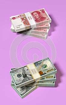 American 100 Dollar and chinese 100 Yuan banknotes on pink background