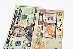 American 20 dollars with Saudi Arabia riyals currency banknotes of 10 Saudi Riyals with photo of king Abdullah