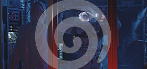 American astronaut testing spacesuit mobility