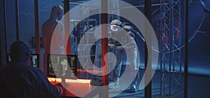 American astronaut testing spacesuit mobility