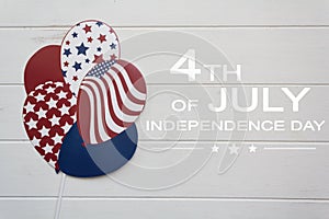 American balloons on white wooden table with the text 4th of July,Independence day