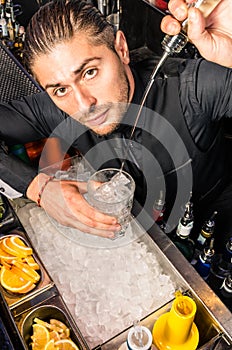 American Bartender pouring a Spirit in the Glass with a smooth freestyle Move