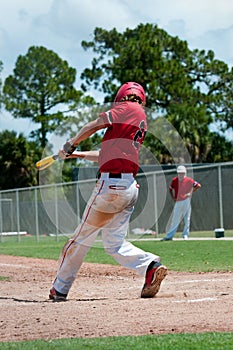 American baseball player swinging bat