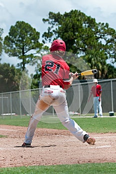 American baseball player swinging bat