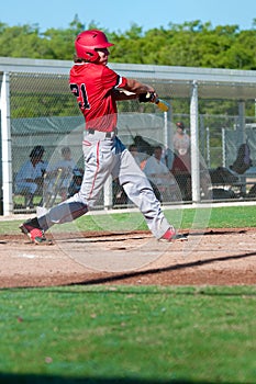 American baseball player swinging bat