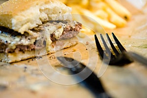 american beef hamburger with cheese and french fries at beautiful fast food and cafe bistro.delicious low price hamburger in