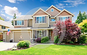 American beige luxury large house front exterior.