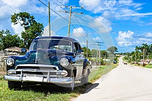 American black 1951 vintage car on the country road in Quintin Banderas to the city Santa