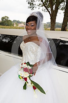 american black bride with limousine wedding car