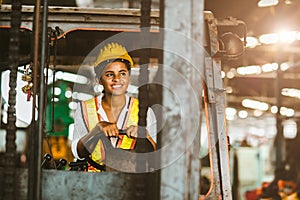 American black women labor worker at forklift driver happy working in industry factory logistic shipping warehouse