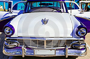 American blue white 1956 vintage car parked direct on the beach in Havana Cuba - Serie Cuba