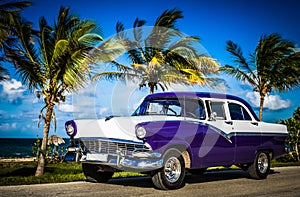 American blue white Ford Fairlane classic car parked on the Malecon near the beach in Havana Cuba - Serie Cuba Reportage