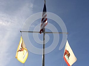 American California San Francisco flags on a ship\'s mast photo