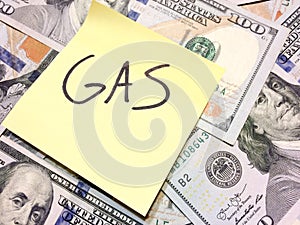 American cash money and yellow paper note with text Gas photo
