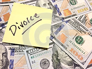 American cash money and yellow post it note with text Divorce