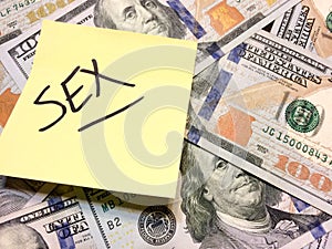 American cash money and yellow post it note with text Sex photo