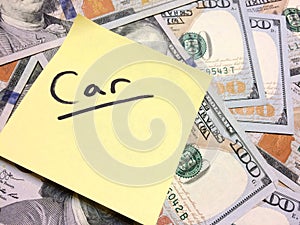 American cash money and yellow sticky note with text Car photo