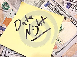 American cash money and yellow sticky note with text Date night photo
