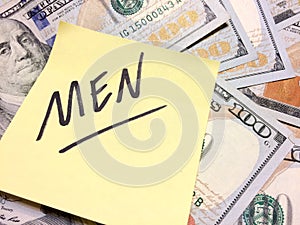 American cash money and yellow sticky note with text Men photo
