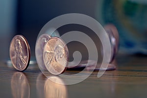 American Cent coins on wooden table