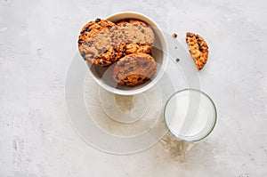 American chocolate chip cookies in a white bowl glass oof milk o